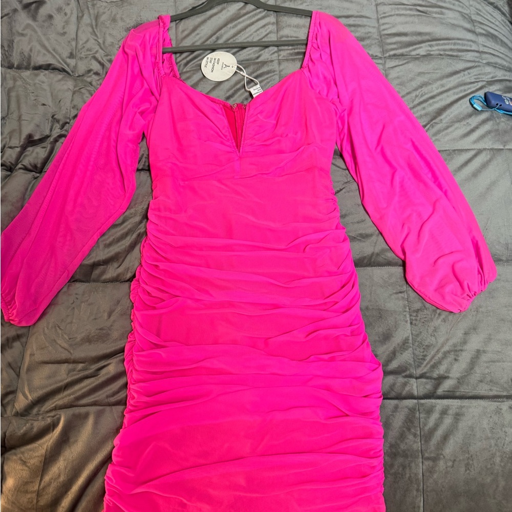 Never worn bright pink touched long sleeve body con dress